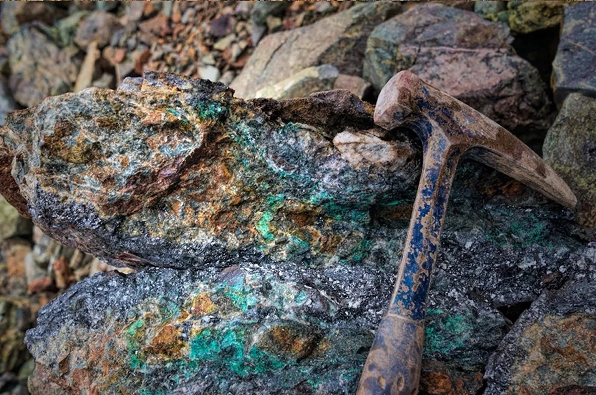 Rock hammer sampling at Chaco Bear